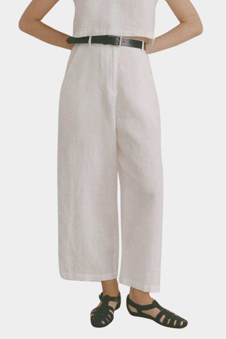 Shaina Mote Paradis trouser in natural organic cotton close-up of front with flat waistband, zipper fly and relaxed leg