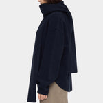 Side view of the Navy Black Long Wool Scarf wrapped around the neck with one end draped down the back