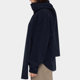 Side view of the Navy Black Long Wool Scarf wrapped around the neck with one end draped down the back