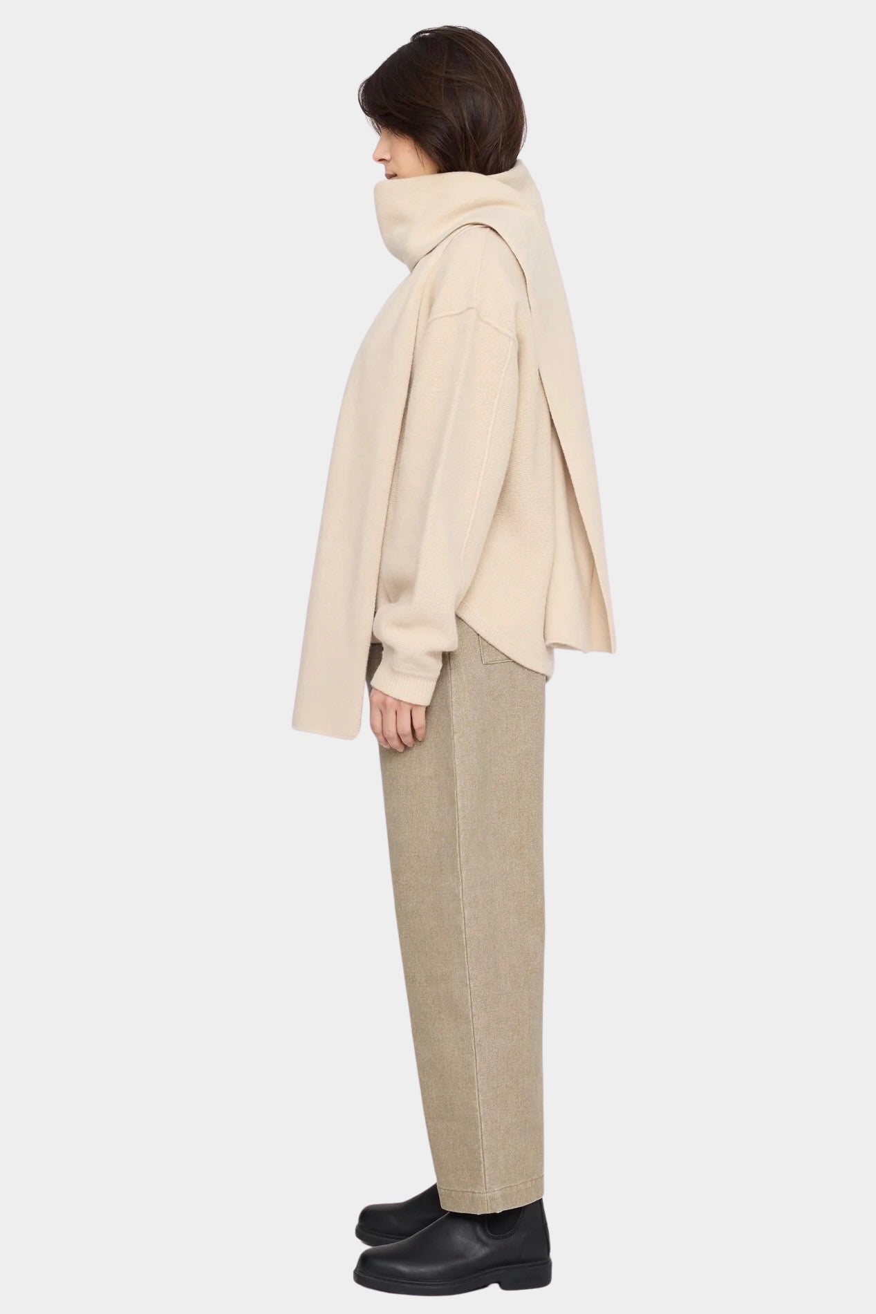 Side view of the off-white Long Wool Scarf wrapped around the neck with long ends draped front and back