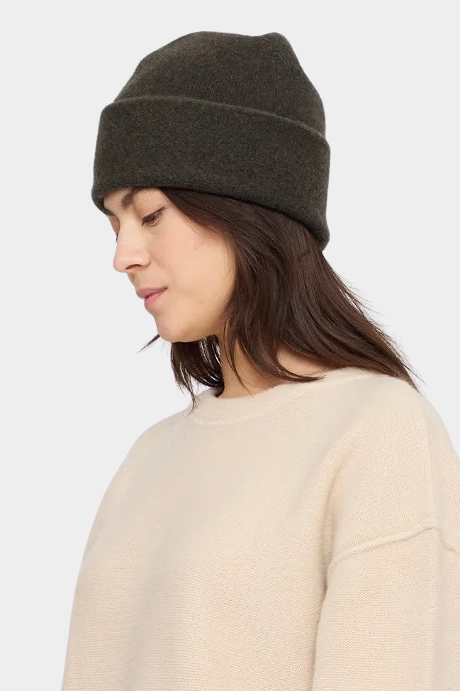 7115 by Szeki Merino Beanie Olive Brown side view showing its softly rounded crown.