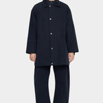 7115 by Szeki Mid-Length Chore Coat Navy front view fastened with snap buttons.