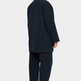 7115 by Szeki Mid-Length Chore Coat Navy angled back view showing the collar and rear seam.