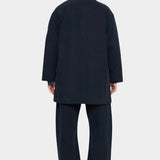 7115 by Szeki Mid-Length Chore Coat Navy back view showing mid length hem and dropped shoulders.