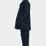 7115 by Szeki Mid-Length Chore Coat Navy side view showing relaxed fit and inset pocket.