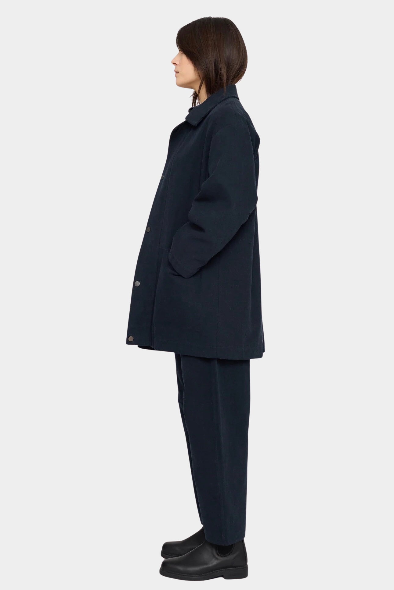 7115 by Szeki Mid-Length Chore Coat Navy side view showing relaxed fit and inset pocket.