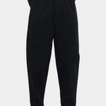 Close front view of the black pull-up trouser showing the elastic waist and softly tapered legs