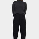 Front view of the black Signature Elastic Pull-Up Trouser with a rounded leg and tapered ankle at YUCCA Denver