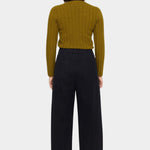 Back view of the black straight legged trouser showing its elastic waist and two patch pockets