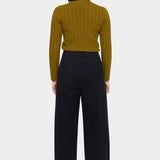 Back view of the black straight legged trouser showing its elastic waist and two patch pockets