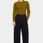 Front view of the 7115 by Szeki black straight legged trouser with a pleated waist and full length leg at YUCCA Denver
