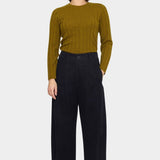 Front view of the 7115 by Szeki black straight legged trouser with a pleated waist and full length leg at YUCCA Denver