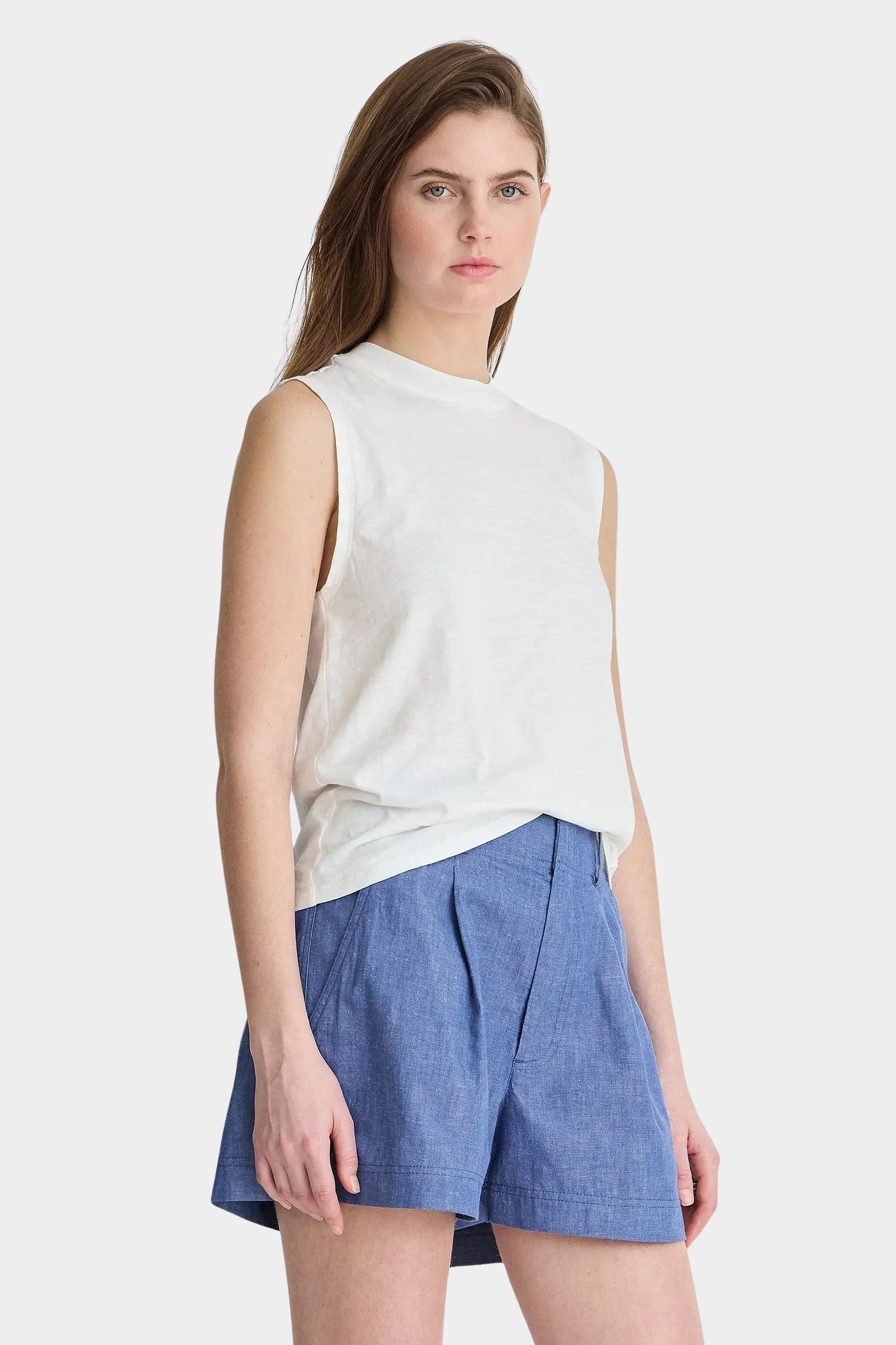 Apiece Apart Forte Tee Cream angled front view styled with chambray shorts and elevated wardrobe staple silhouette
