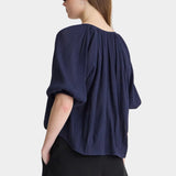 Back view of Apiece Apart Lo Campo Shirt Navy airy pullover blouse with gathered detailing and soft volume
