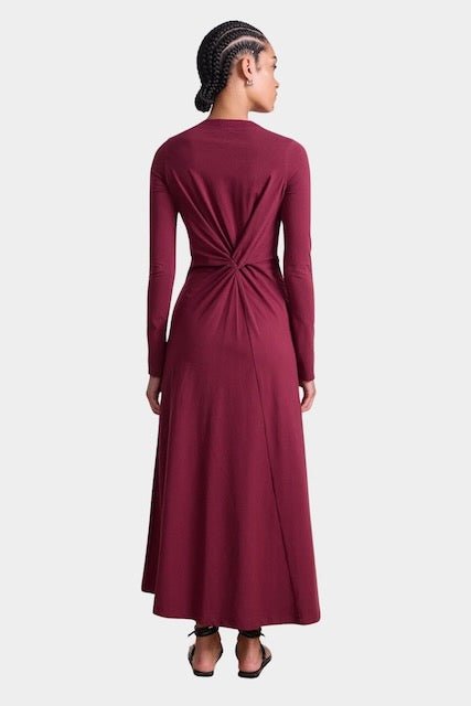 Apiece Apart Long Sleeve Volta Dress in Black Cherry with twist detail and midi silhouette at YUCCA Denver