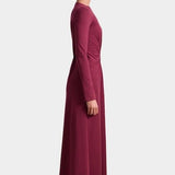 Apiece Apart Long Sleeve Volta Dress in Black Cherry with twist detail and midi silhouette at YUCCA Denver