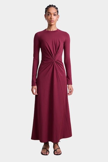 Apiece Apart Long Sleeve Volta Dress in Black Cherry with twist detail and midi silhouette at YUCCA Denver