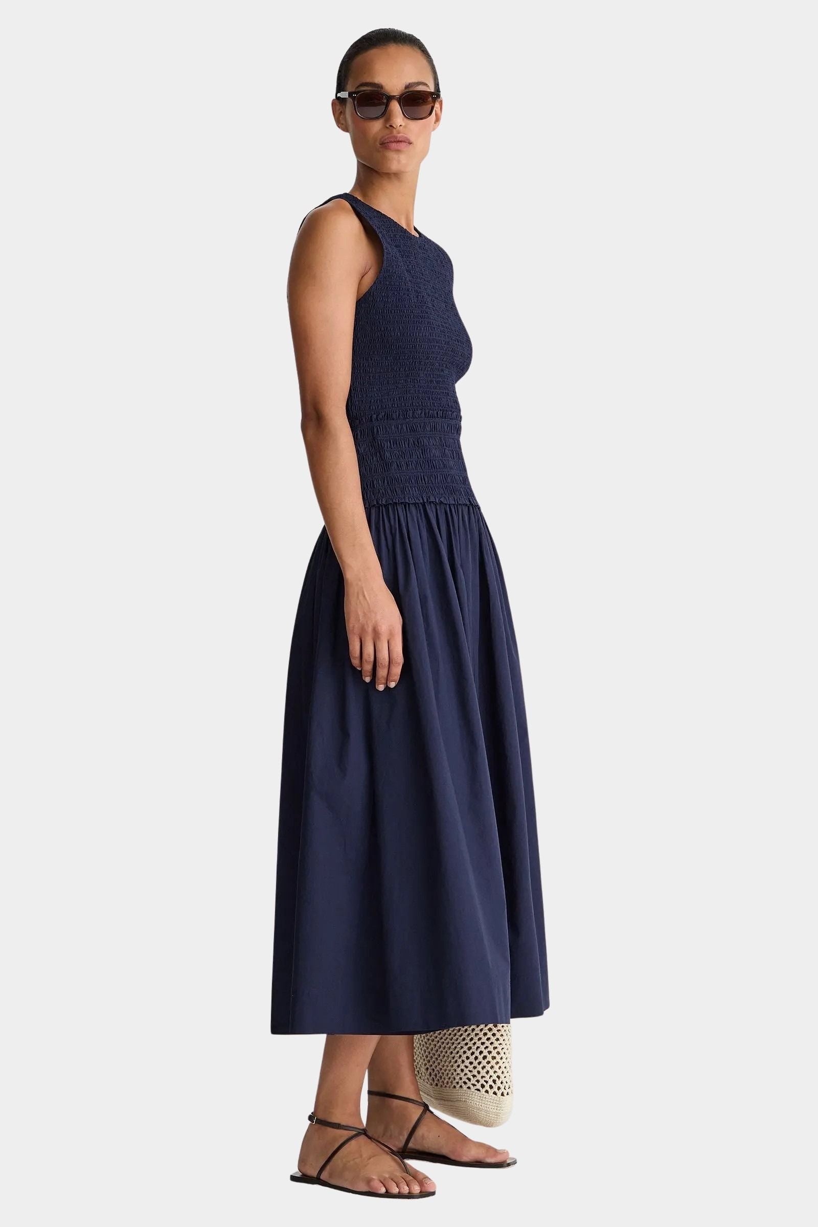 Midnight navy smocked maxi dress side view sleeveless crew neckline lightweight cotton flowy A-line skirt