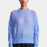 Apiece Apart Softest Tissue Weight Sweater in Cornflower blue cashmere silk knit styled with tailored trousers at YUCCA Denver