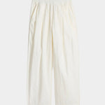 Apiece Apart Spa Pleat Pant Cream product flat lay in lightweight organic cotton with elastic waistband and pleated shape