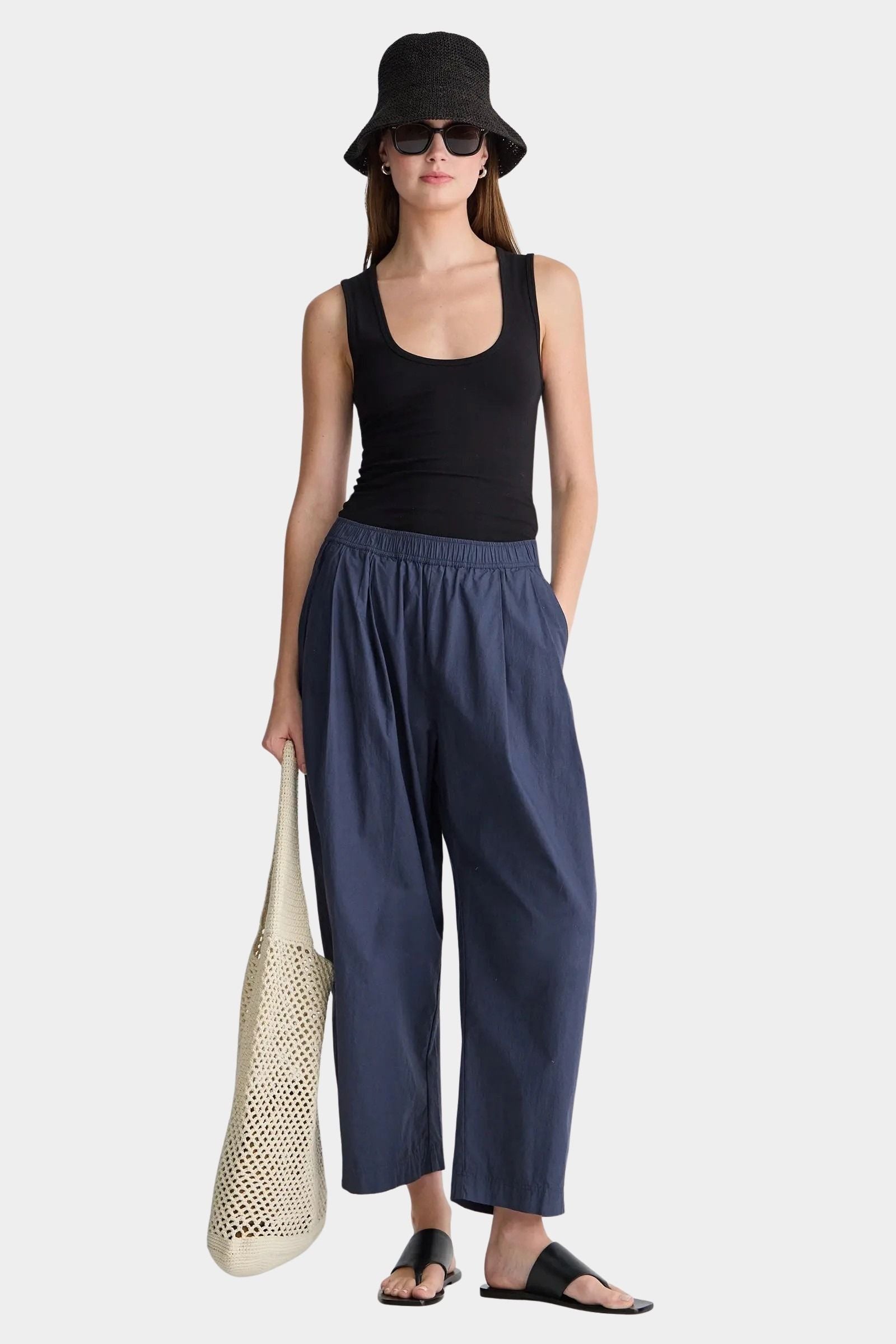 Apiece Apart Spa Pleat Pant Navy front styling view with elastic waist barrel leg silhouette and relaxed organic cotton fit