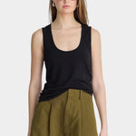 Apiece Apart Uri Low-Cut Tank Black front view with scoop neckline and olive tailored shorts