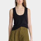 Apiece Apart Uri Low-Cut Tank Black front view with scoop neckline and olive tailored shorts