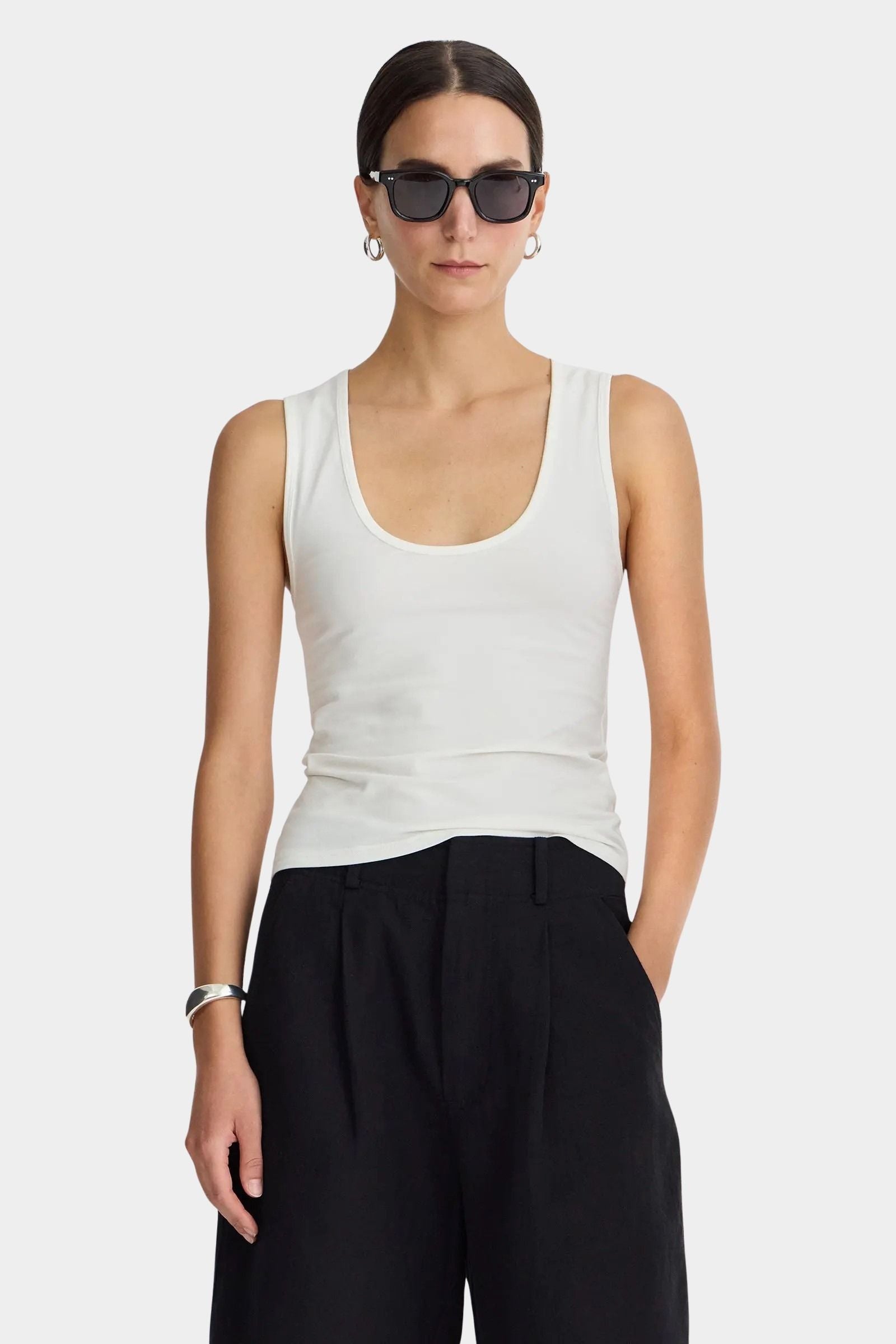 Front view of Apiece Apart Uri Low-Cut Tank Cream with scoop neckline and fitted silhouette