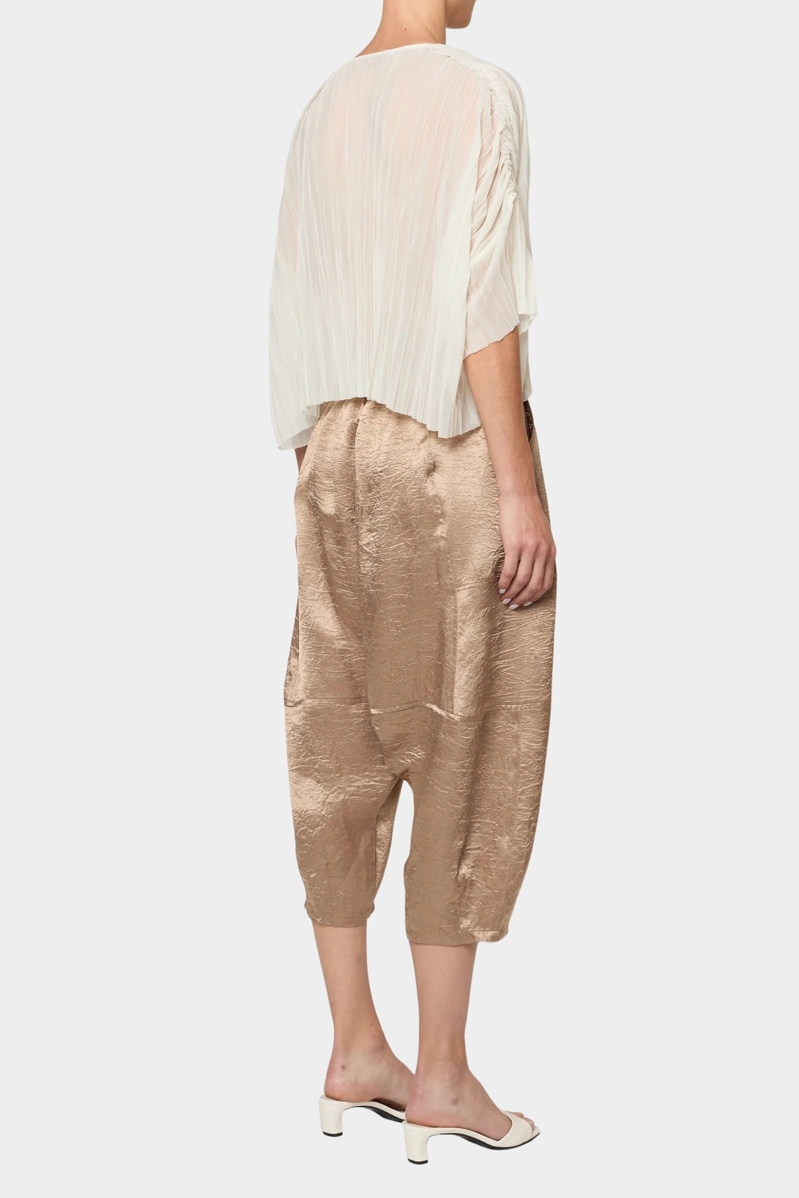 Atelier Delphine Kiko pant in latte angled back view showing textured fabric and elastic waistband