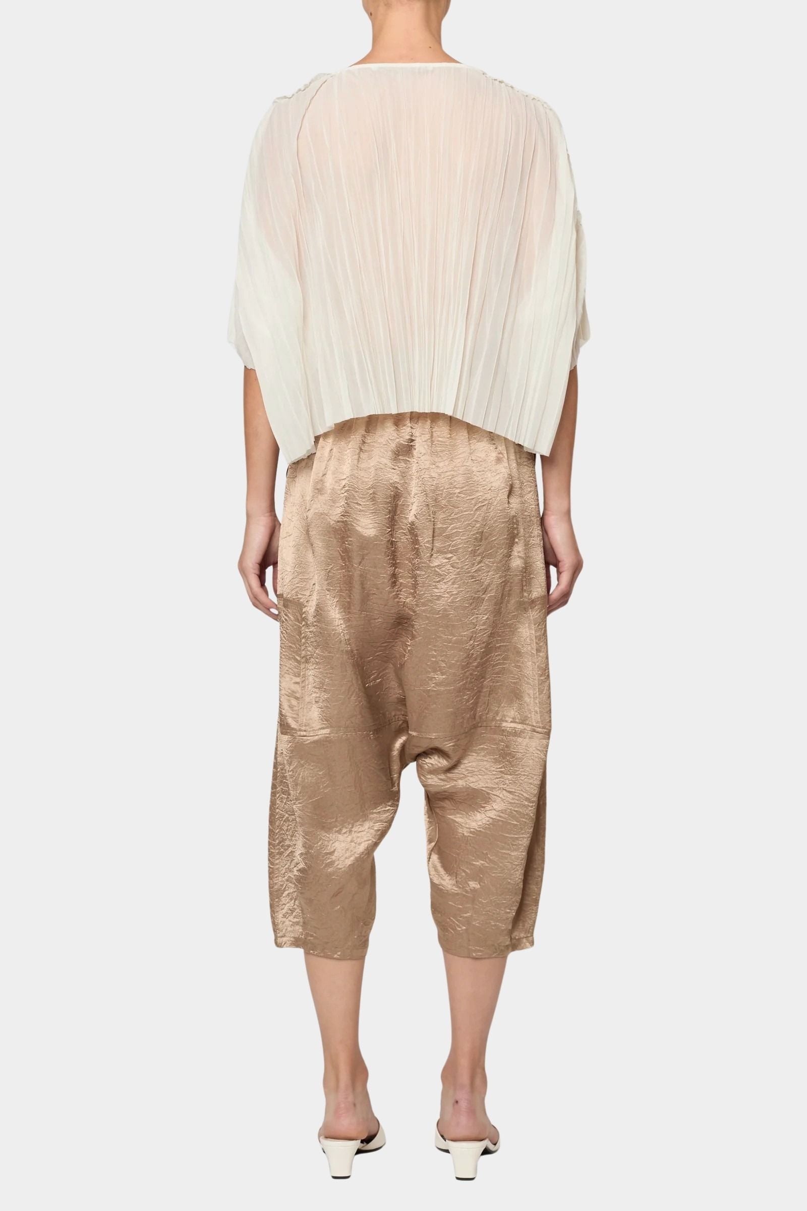 Atelier Delphine Kiko pant in latte back view showing relaxed drop crotch silhouette and cropped length