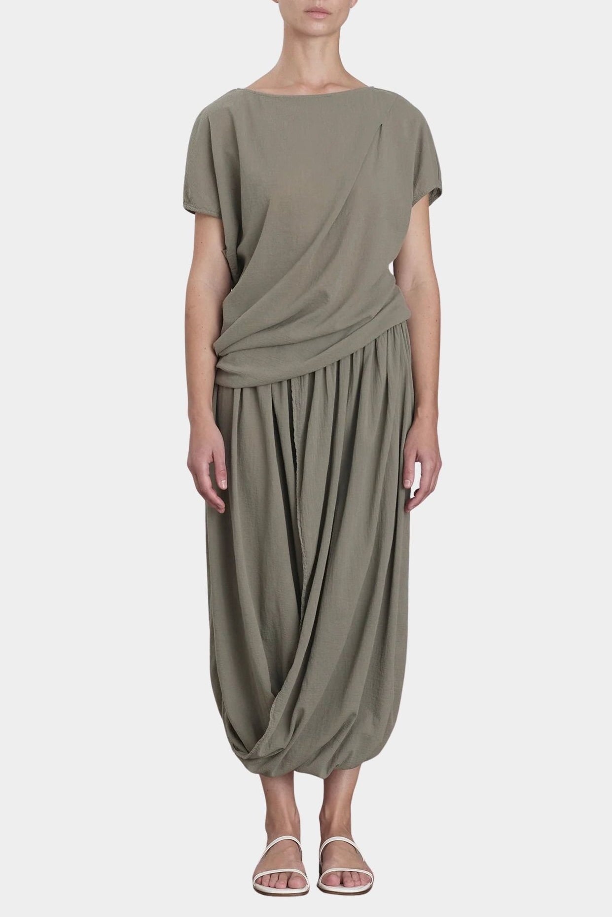 Black Crane asymmetric cotton gauze top cement mid length view highlighting fluid drape and silhouette