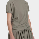 Black Crane asymmetric cotton gauze top cement front detail showing pleat and directional drape