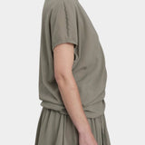 Black Crane asymmetric cotton gauze top cement side profile with relaxed fit and lightweight textu