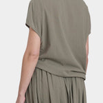 Black Crane asymmetric cotton gauze top cement back view showing soft drape and short sleeve silhouette