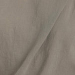 Black Crane cotton gauze fabric in cement color close up showing soft textured weave