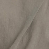 Black Crane cotton gauze fabric in cement color close up showing soft textured weave