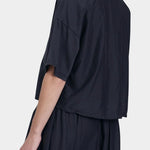 Black Crane cropped shirt faded black back detail showing clean lines and soft structure