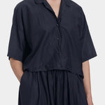 Black Crane cropped shirt faded black close-up of collar and button front detail