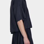 Black Crane faded black cropped button-up shirt side view with relaxed fit