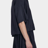 Black Crane faded black cropped button-up shirt side view with relaxed fit