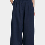 Black Crane Wide Pants Navy front view hands in pockets textured cotton