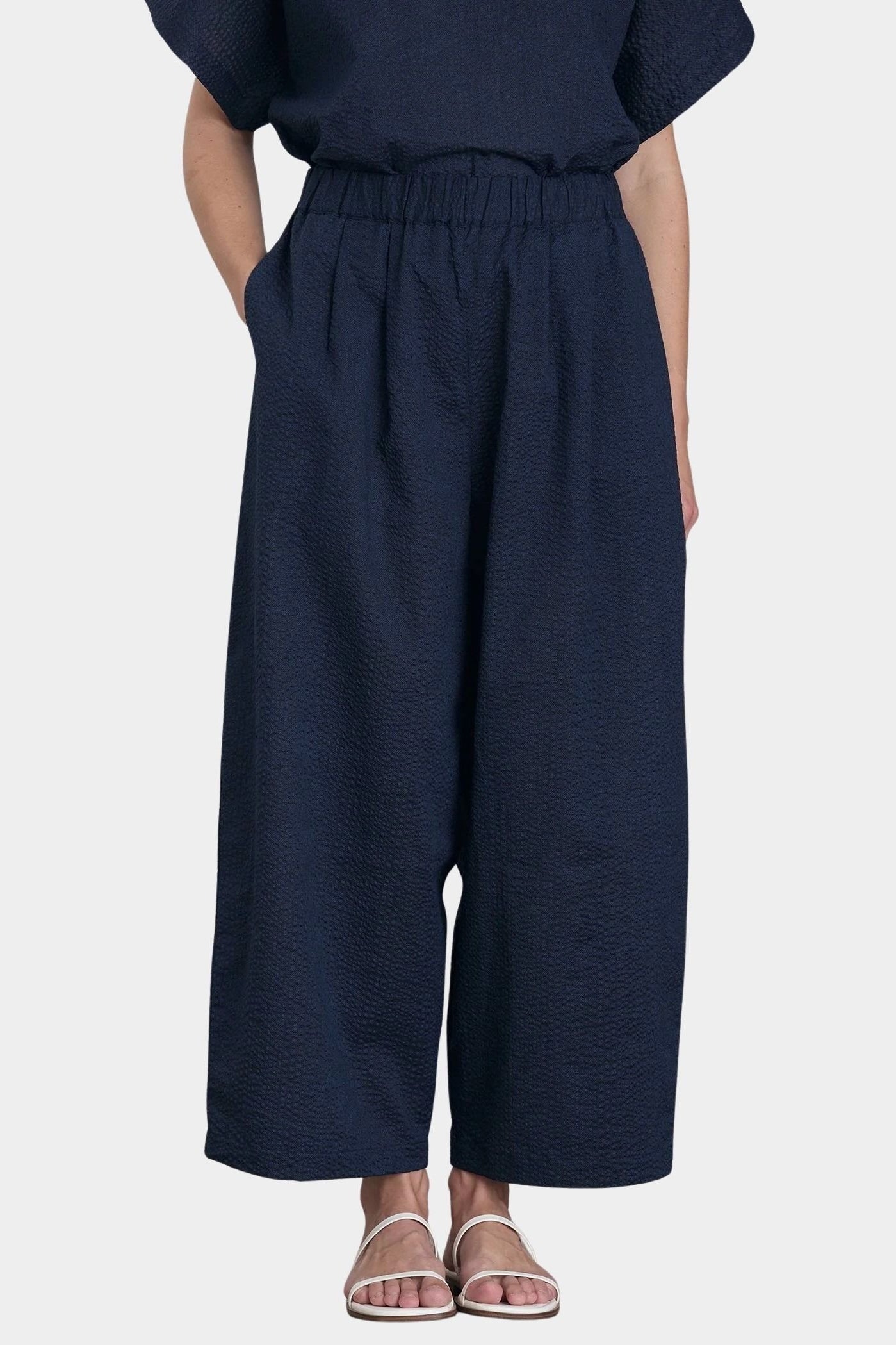 Black Crane Wide Pants Navy front view hands in pockets textured cotton