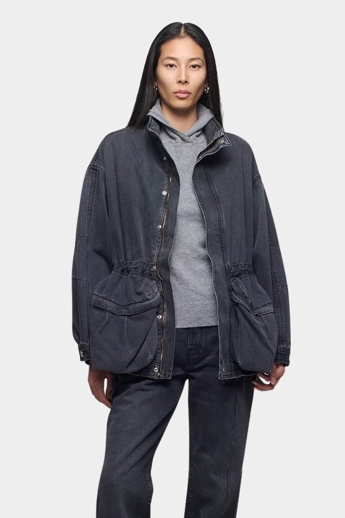Close up of the DALA Mountain Jacket in Hurricane, worn open over a gray hoodie with matching denim, from YUCCA Denver.