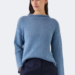 Model wearing DEMYLEE Lamis denim washed cotton sweater with dropped shoulders and relaxed silhouette