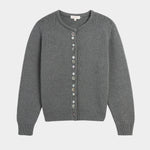 Close view of decorative shell buttons on the charcoal cardigan at YUCCA, a Denver women’s boutique