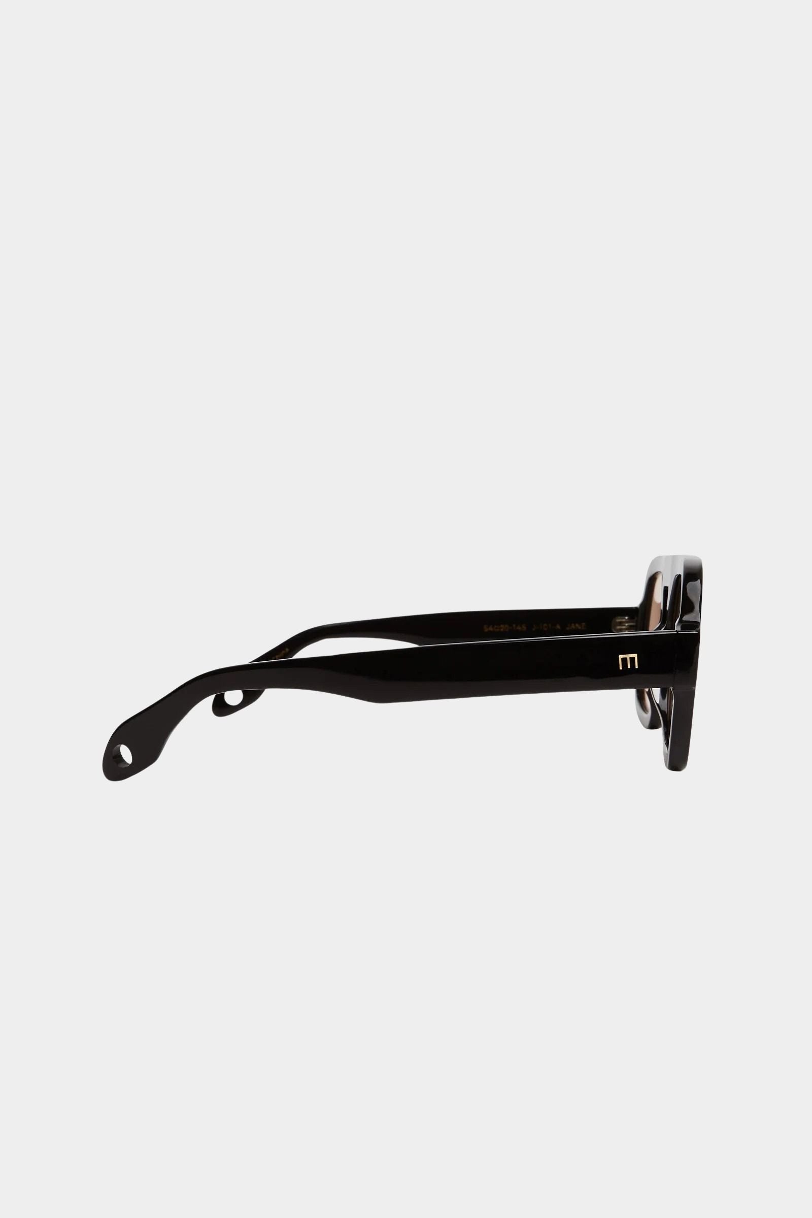Side profile of Elisa Johnson Jane sunglasses in gloss black acetate with thick temples and tinted lenses