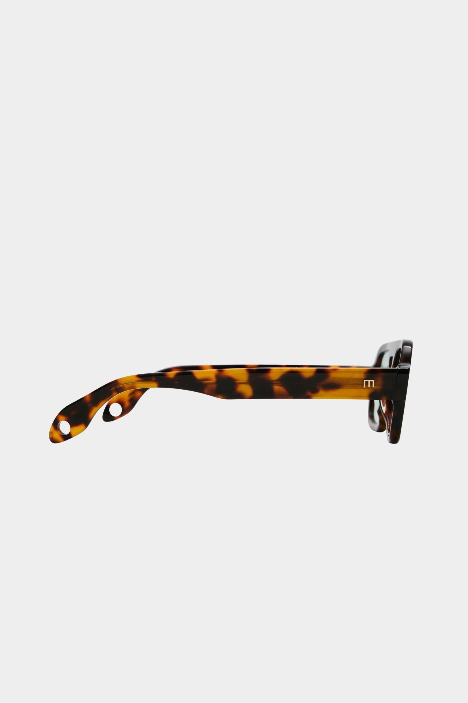 Side profile of Elisa Johnson Jane Mini sunglasses in brown tortoise acetate with thick temples and tinted mint lenses