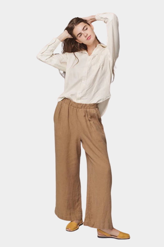 Model wearing the Jungmaven Cambria Pant in Coyote with an elastic waistband and easy pull-on fit
