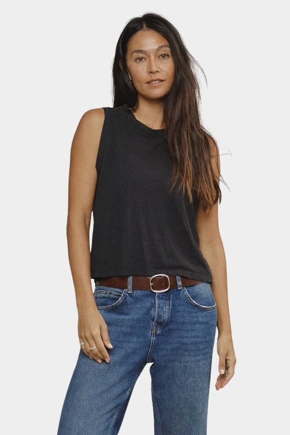 Black relaxed fit muscle tank styled with blue denim front view