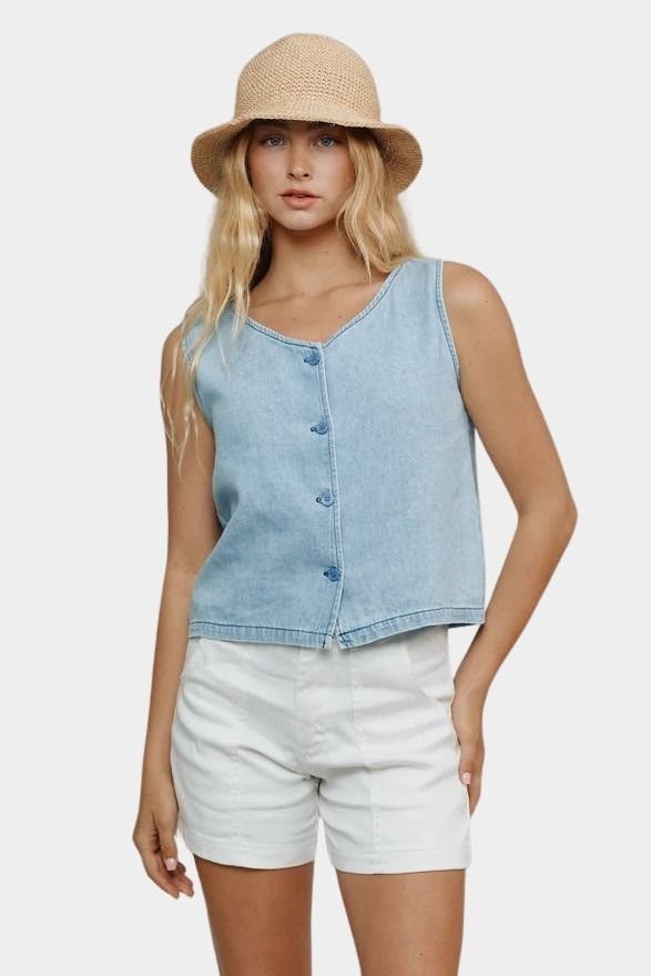 Jungmaven light denim sleeveless vest styled with white shorts front view
